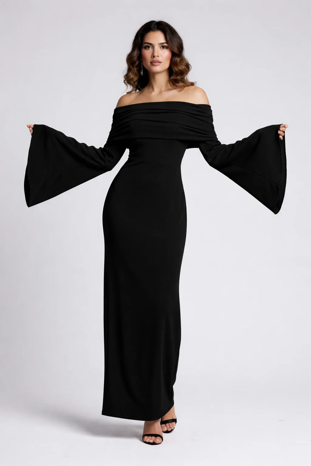 Model wearing House of Raeli black off-shoulder maxi dress